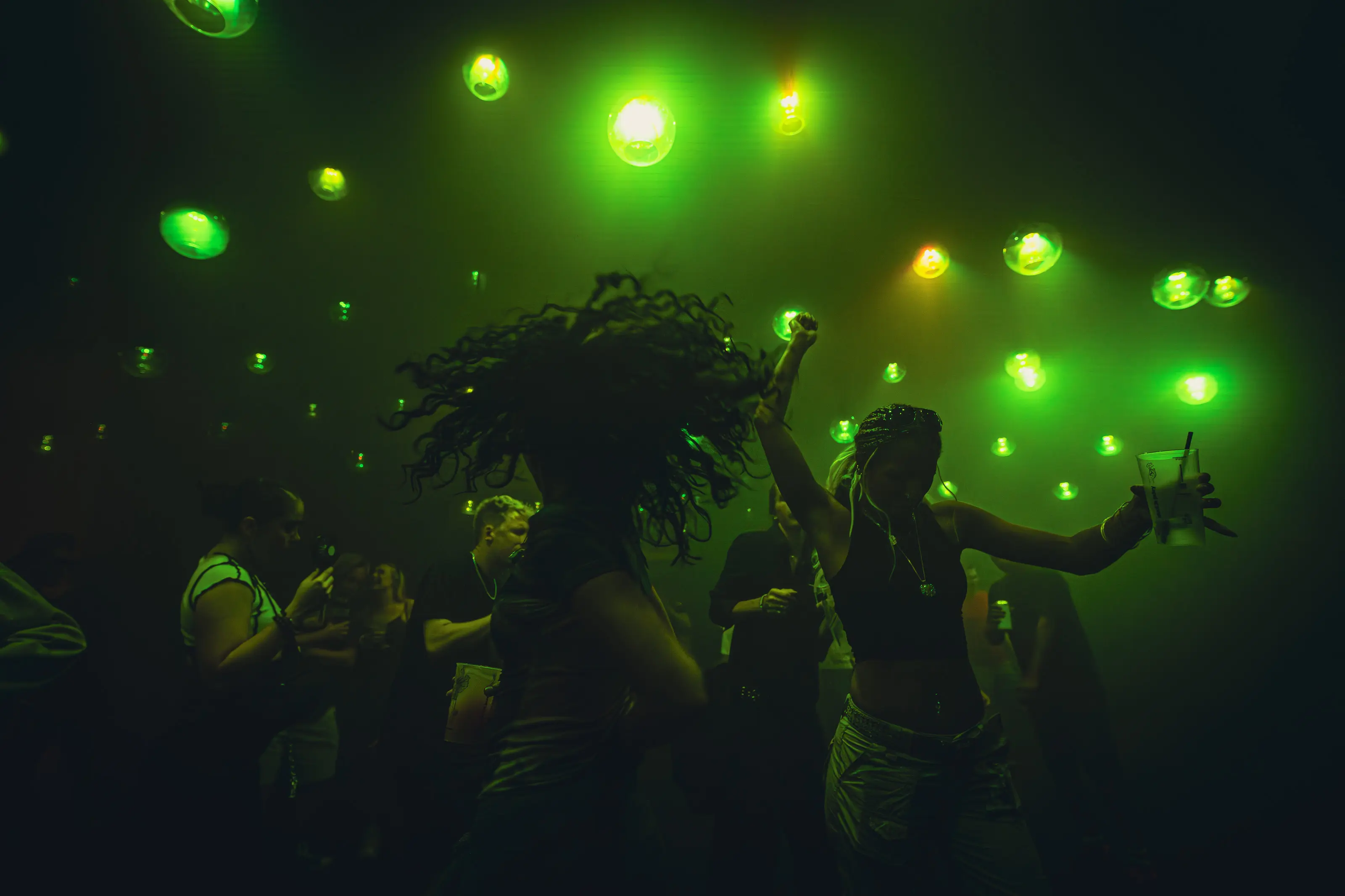 Launch party crowd moving through multiple interactive zones at Depot Mayfield